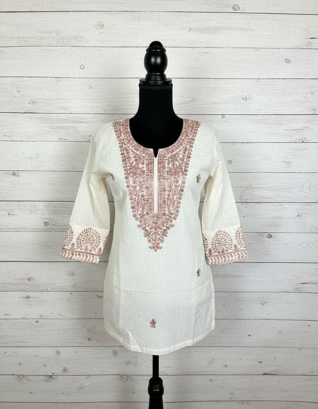 Off white dobby cotton with multi-colored embroidery in M