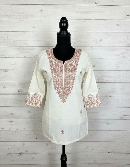 Off white dobby cotton with multi-colored embroidery in M