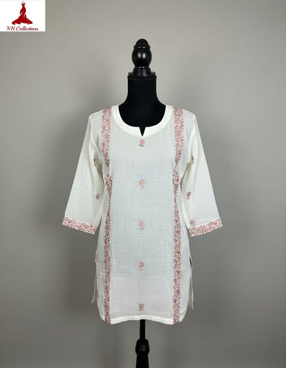 Off white dobby cotton with multi-colored vertical embroidery lines in M