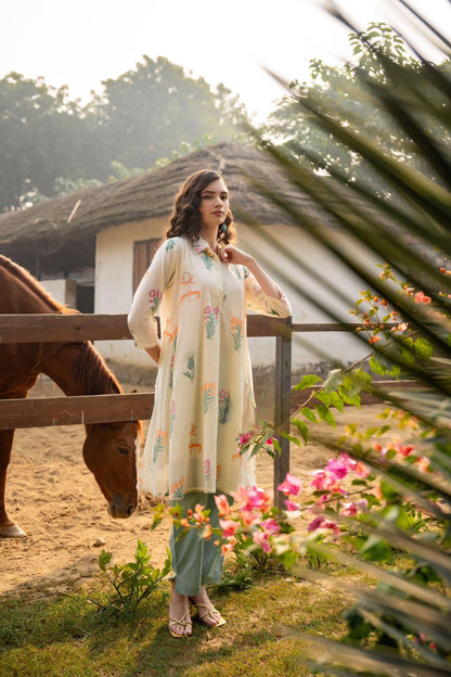 Women's beige floral block printed A-line Kurta with sage green pants in M